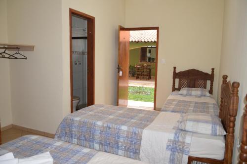 Ένα ή περισσότερα κρεβάτια σε δωμάτιο στο Hotel Colonial