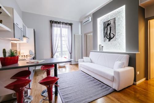 Ένα ή περισσότερα κρεβάτια σε δωμάτιο στο Apart Hotel Torino