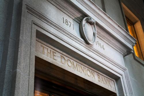 a sign on the door of a building at One King West Hotel and Residence in Toronto