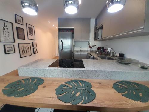 a kitchen with a counter with a stove top oven at LK Funcionários 1 in Belo Horizonte