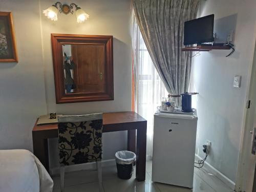TV a/nebo společenská místnost v ubytování Blouberg Manor