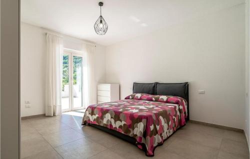 a white bedroom with a bed with a red blanket at Beautiful Home In Farindola With 2 Bedrooms in Farindola