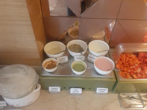 a display of different types of food in a kitchen at Best Western Vrindavan in Vrindāvan