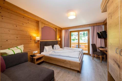 Postel nebo postele na pokoji v ubytování Hotel Kitzspitz