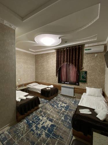 Ένα ή περισσότερα κρεβάτια σε δωμάτιο στο DAVAN Hotel
