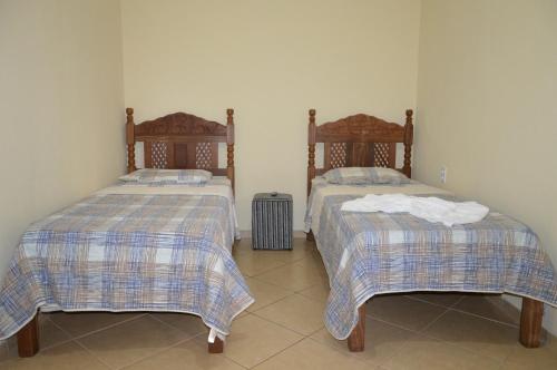 Ένα ή περισσότερα κρεβάτια σε δωμάτιο στο Hotel Colonial
