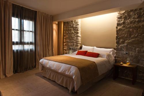 Postel nebo postele na pokoji v ubytování Hotel Palacio del Obispo