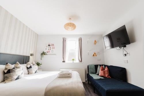 Postel nebo postele na pokoji v ubytování Prime Suites Lytham