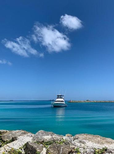 a boat in the middle of a large body of water at Konut by Thakuru in Guraidhoo