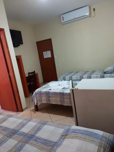 Ένα ή περισσότερα κρεβάτια σε δωμάτιο στο Hotel Colonial