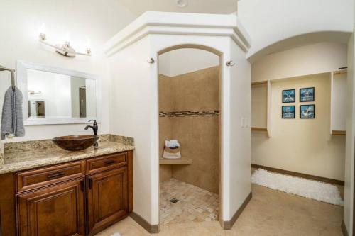 a bathroom with a sink and a shower at Heated Pool & Spa - Winterhavens Oasis in Lake Havasu City