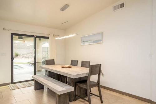 a dining room with a wooden table and chairs at Heated Pool & Spa - Winterhavens Oasis in Lake Havasu City