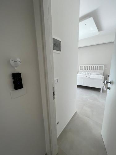 a white room with a bed in the background at Campione 5 in Bari