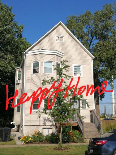 a house with a happy anniversary sign in front of it at 5430 Happy Home in Chicago
