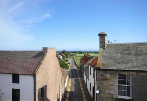 a view of a street in a town with buildings at Number Twenty Six - 2 miles from Elie Beach - 15mins to St Andrews in Colinsburgh