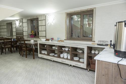 a kitchen with a counter and a dining room at AHMAD guest house in Samarkand