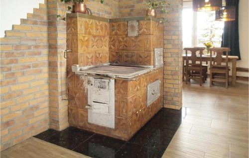 a brick wall with an oven in a kitchen at One-Bedroom Holiday Home In Biadoliny Szlachecki in Biadoliny Szlacaheckie