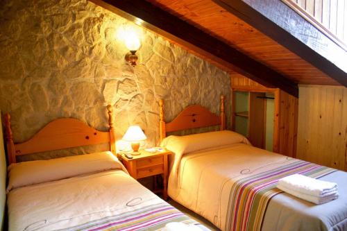 Postel nebo postele na pokoji v ubytování Hotel Casa Domenc
