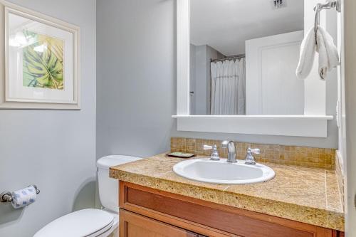 a bathroom with a sink and a toilet at The Grand #2703 in Destin