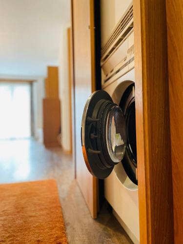 a washer and dryer on a door in a room at Im alten Dorfteil von Zermatt in Zermatt