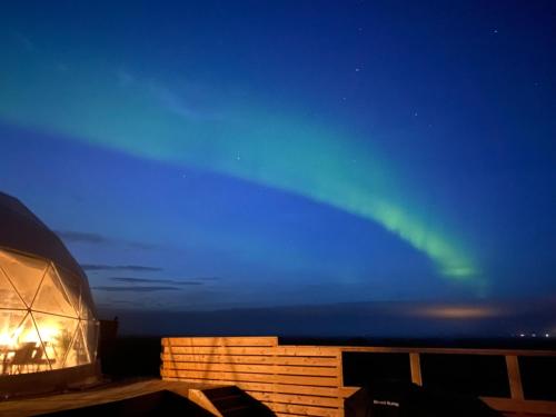 a view of the aurora from a yurt at night at Hvítuborgir in Minni-Borg