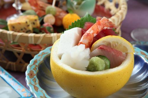 a bowl of food on a plate on a table at Mutsumikan in Gero