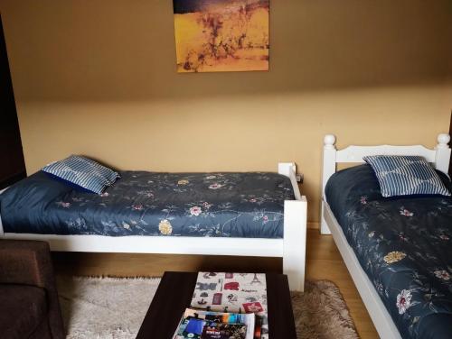 En eller flere senge i et værelse på Casa En Gregores