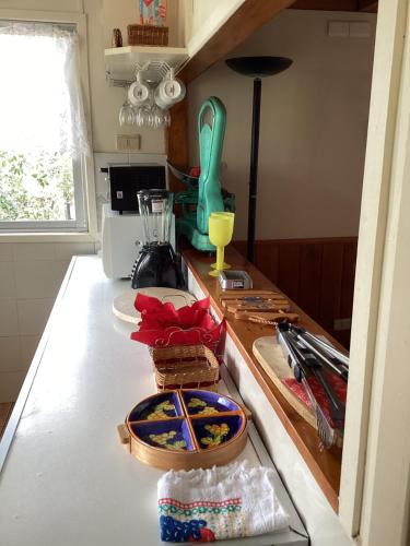 a kitchen counter with a table with food on it at Cabaña Quillón El Campito in Quillón