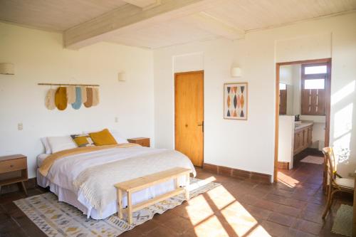 a bedroom with a bed and a table in it at Casa Mario Boutique Hotel 