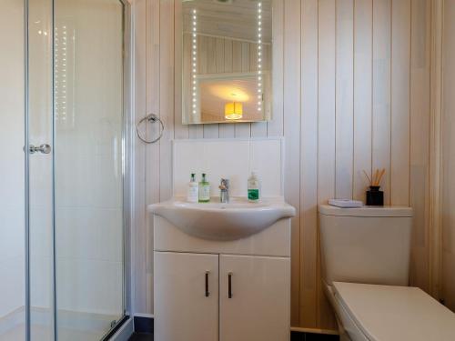 a bathroom with a sink and a shower at Acer Lodge-uk37594 in Willington