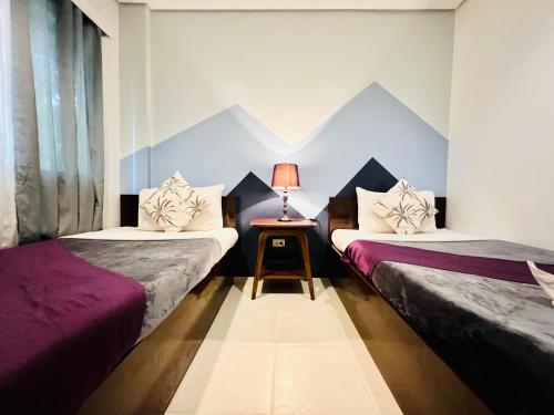 Ένα ή περισσότερα κρεβάτια σε δωμάτιο στο Coron Ecolodge