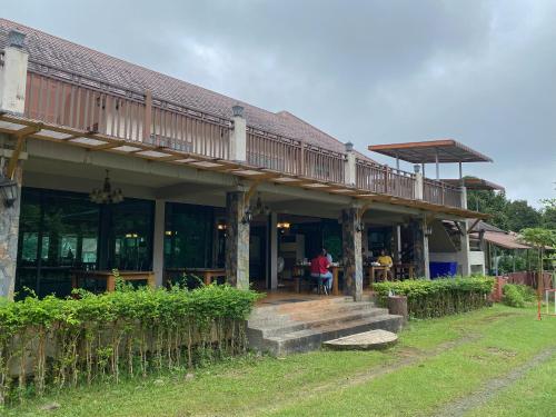 a house with a deck on top of it at Akantuka Homestay in Chanthaburi