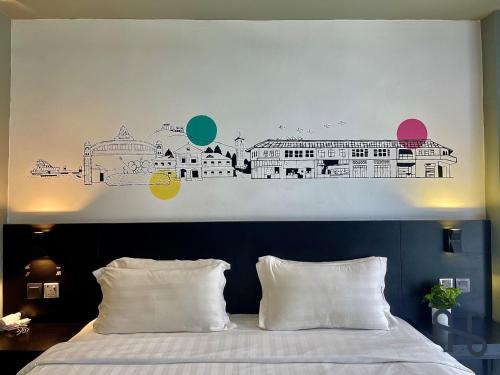 a bedroom with a bed with a mural of a city at Homesuite' Home at Aeropod SOVO in Kota Kinabalu