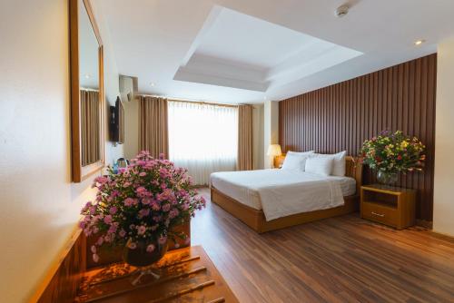Postel nebo postele na pokoji v ubytování Roseland Corp Hotel