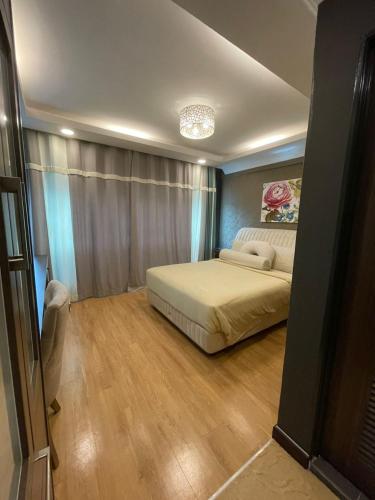 a bedroom with a bed in a room at Grand Illusyin in Shah Alam