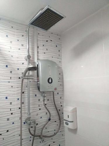 a shower in a bathroom with a shower at D Riverside Inn in Malacca