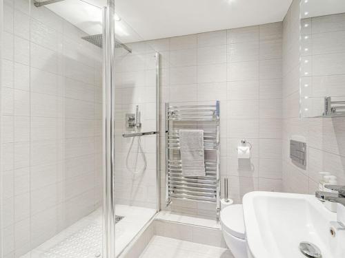 a bathroom with a shower and a toilet and a sink at Alnwick Pad in Alnwick