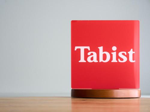 a red book with the word tadaisk on it at Tabist Hotel Takagiya Iwaki in Hisanohama