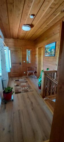 an inside view of a room with wooden walls and ceilings at Ruhig gelegene Ferienwohnung im Grünen mit Terrasse und kleinem Garten in Rotthalmünster