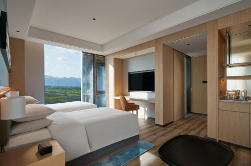 Televisyen dan/atau pusat hiburan di Hyatt Place Huangshan Train Station