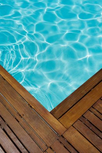 a close up of a pool with blue water at FLH Mouraria Art Apartment with Pool in Lisbon