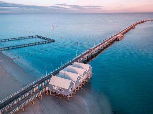 an aerial view of a dock in the water at Busselton Jetty Chalets in Busselton