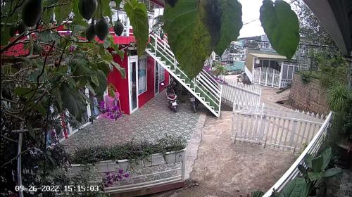 a stairway leading to a red and white house at Mr.Khanh Coffee in Xuân Trường