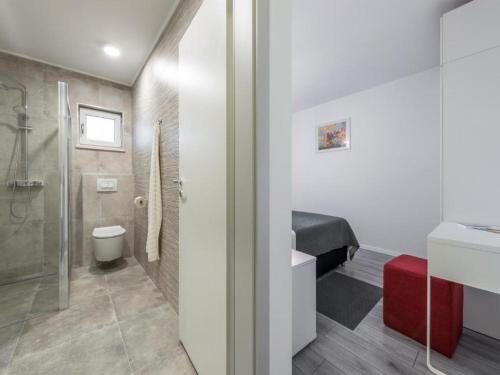 a bathroom with a shower and a toilet and a sink at Family Holiday Home Nest in Mlini