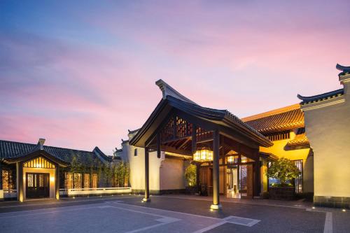 an exterior view of a building at dusk at Banyan Tree Yangshuo in Yangshuo