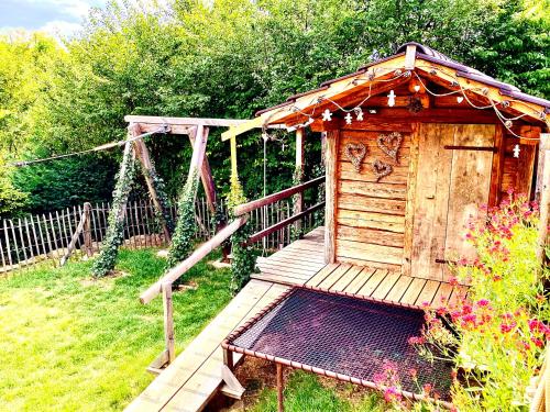 Zahrada ubytování Chalet du Silberrain près de Colmar - cheminée, sauna, piscine partagée