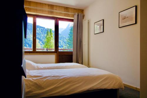 Postel nebo postele na pokoji v ubytování Cocon la Plagne