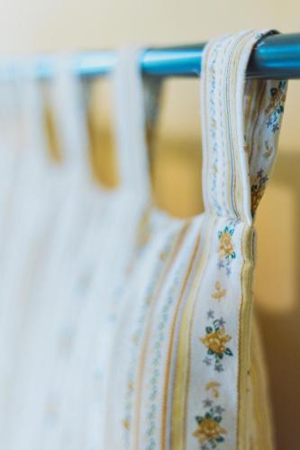 a close up of a white vase on a rack at Agriturismo Montevecchio Isolani in Monte San Pietro