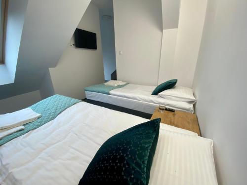 Postel nebo postele na pokoji v ubytování Apartamenty Divemed