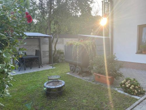 a backyard with a grill and a table and a grill at Penzio Ostrava in Ostrava